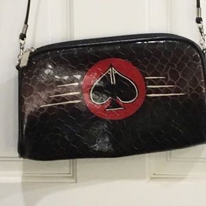 Black plastic alligator pattern with hand painted design